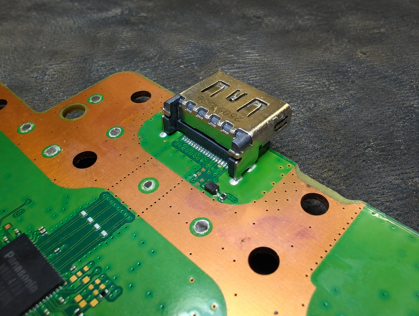 New PS5 HDMI port fitted to a console motherboard at iPhoneBits