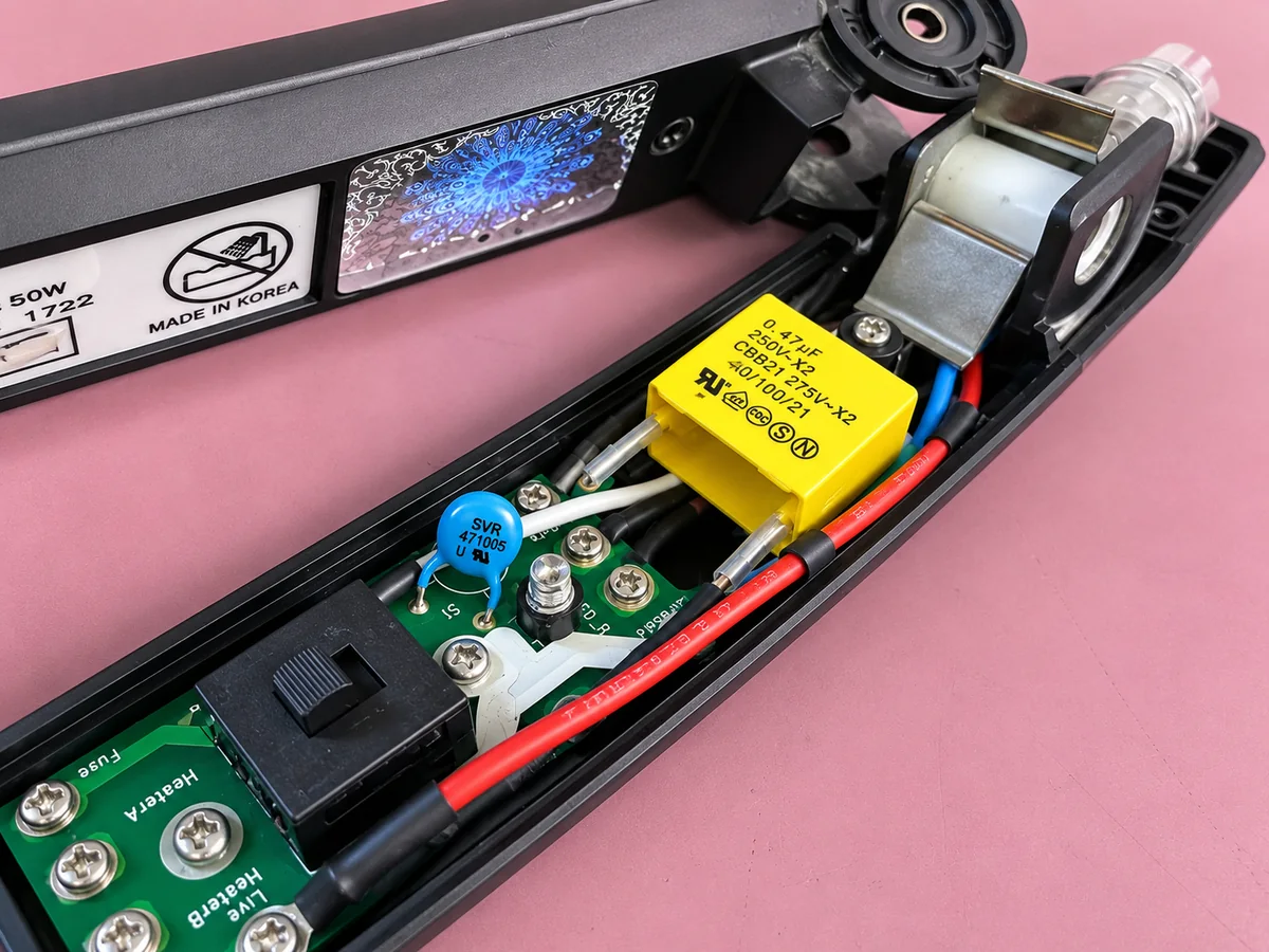 Opened GHD hair straighteners showing the internal circuit board at iPhoneBits in Glengormley