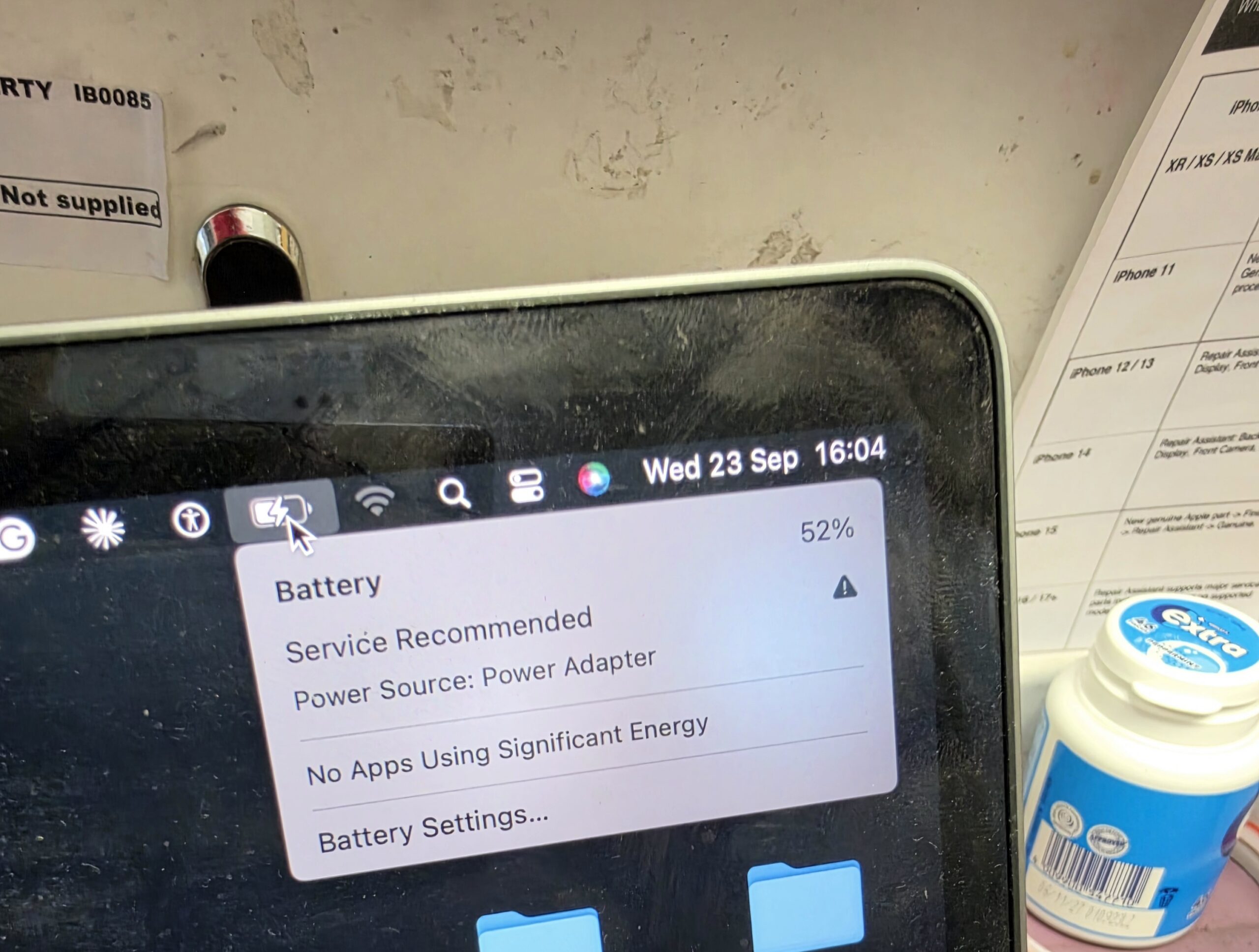 MacBook Pro battery menu showing Service Recommended and Power Source: Power Adapter after charging port repair