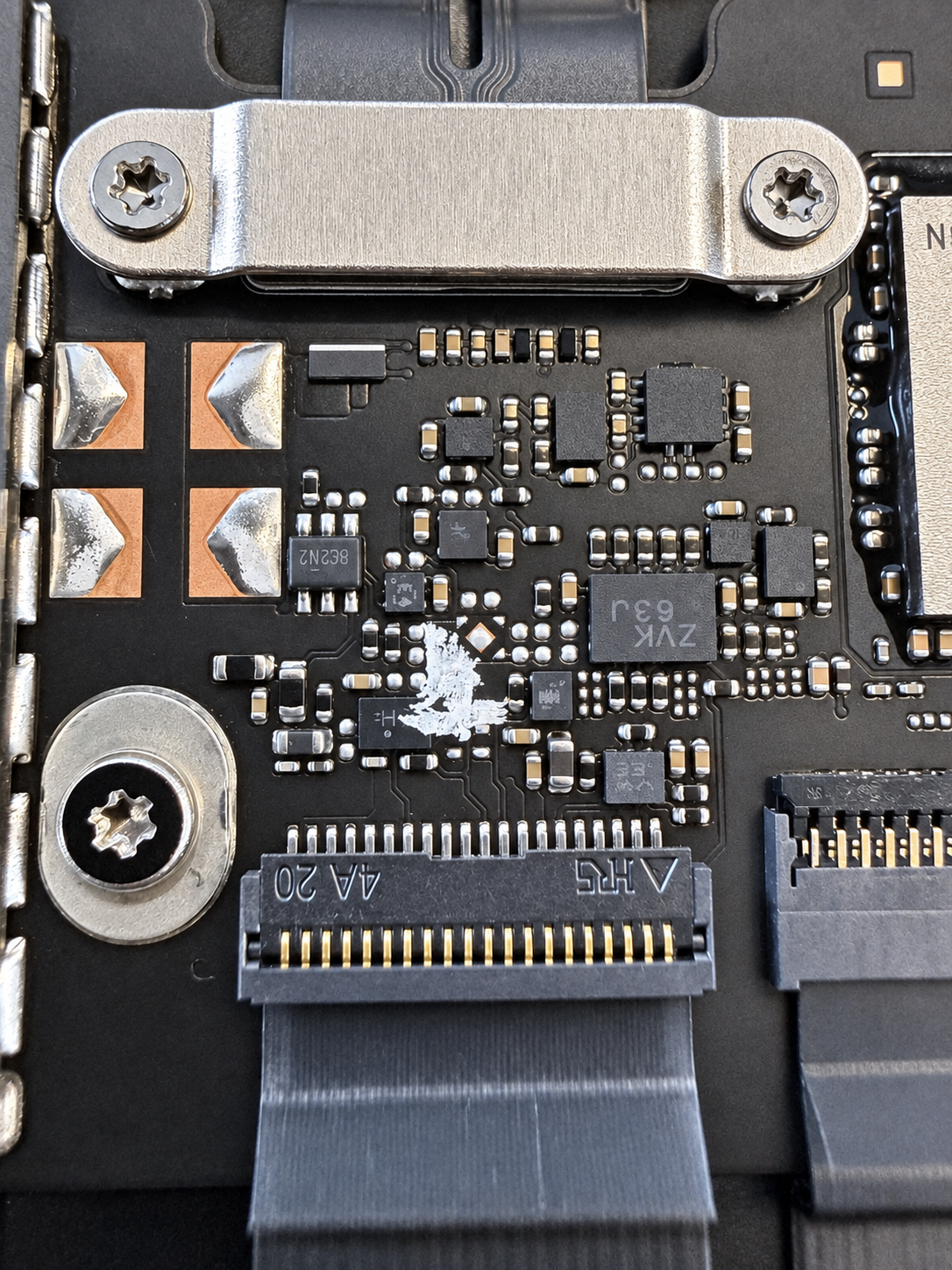 MacBook Neo logic board after liquid damage cleaning and repair at iPhoneBits