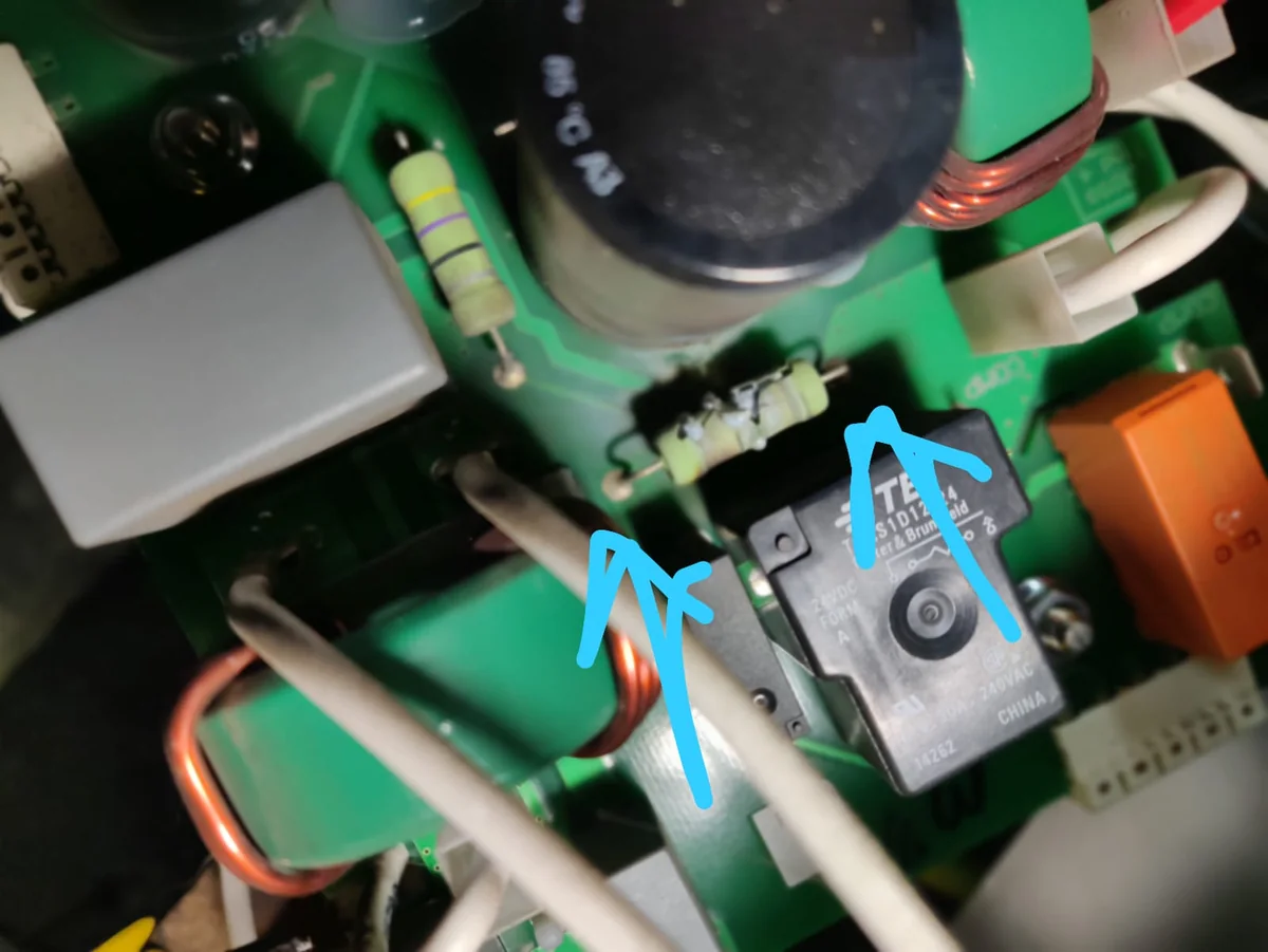 Close-up of power supply circuit board components with existing workshop annotations