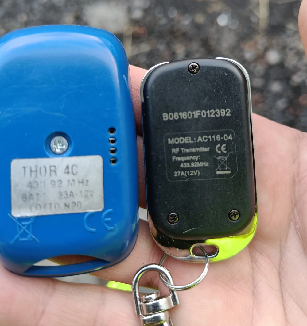 Two handheld remote fobs with their identification labels visible