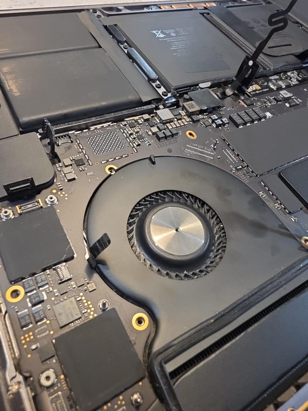 Opened MacBook Pro A1990 during no-power diagnosis at iPhoneBits near Belfast