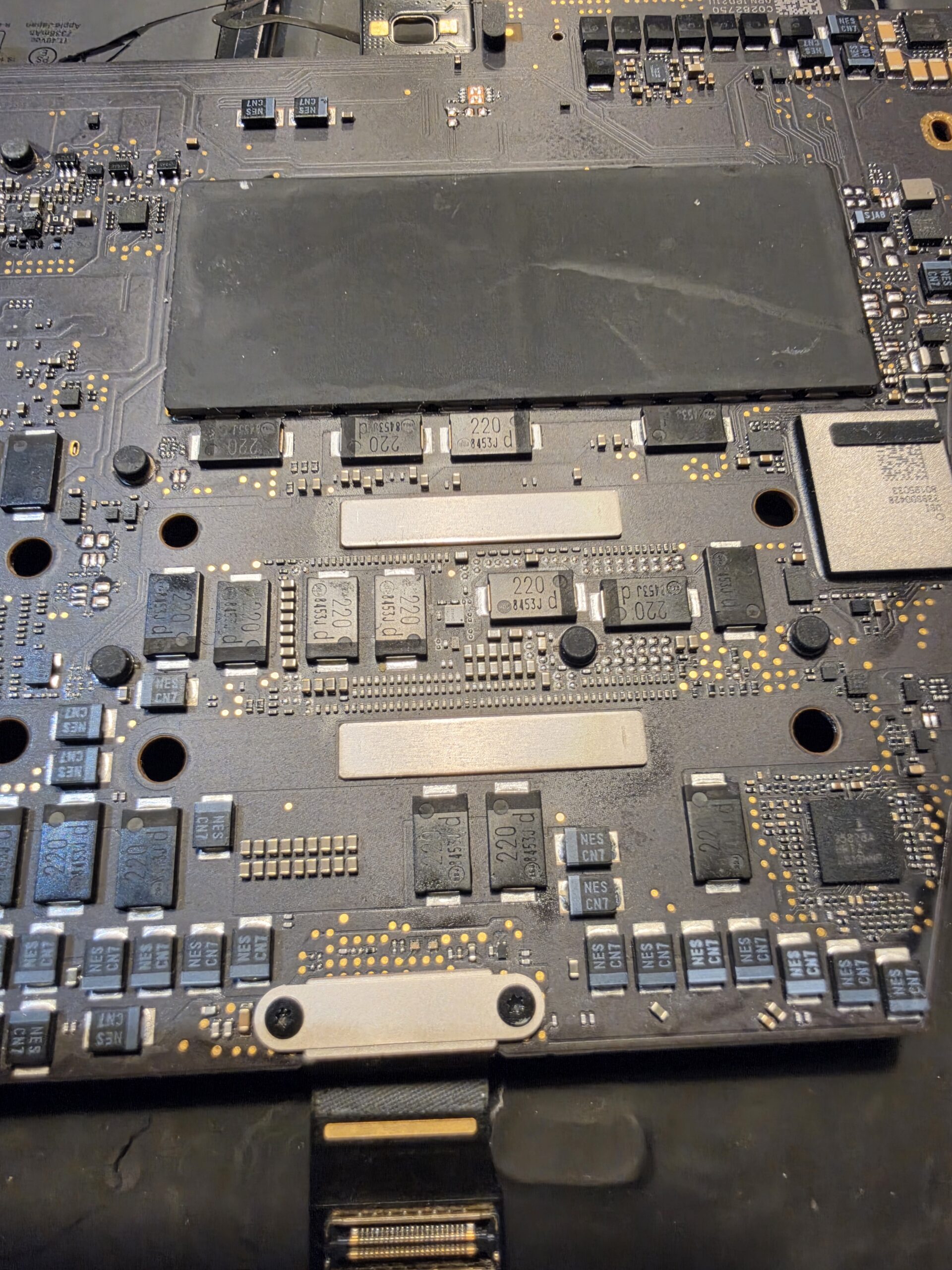 MacBook 820-01814-01 logic board area investigated around F7000 and F7001